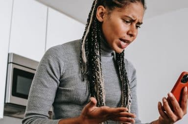 woman who is angry at her cell phone