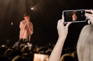 taking a video at a concert