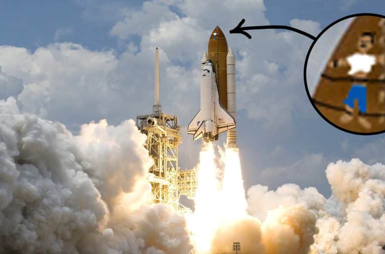 guy strapped to the top of a shuttle
