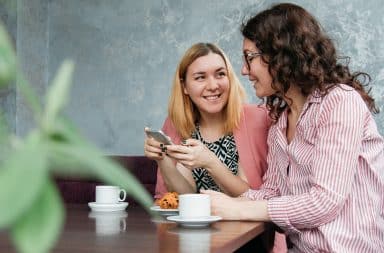 women chatting over coffee