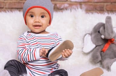 lil guy holding a shoe