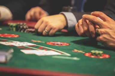 Gambler hands at table