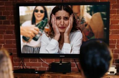 woman is anxious because she is stuck in TV