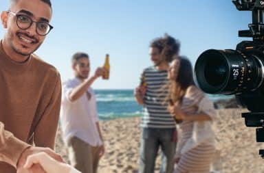 guy is happy on the beach in front of the cameras