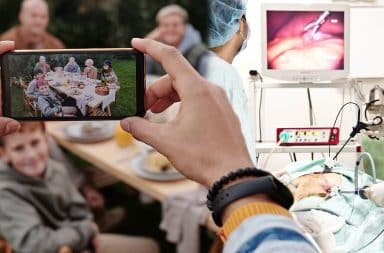 a family posing for a photo and then nearby there's a colonoscopy happening