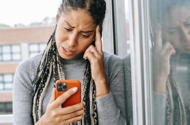 woman looking confused on the phone