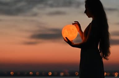 woman holding the orb