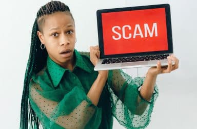 woman with a scam laptop