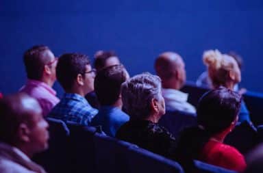 people sitting down at the show