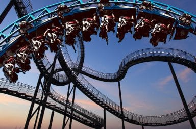 people who are upside down on a roller coaster