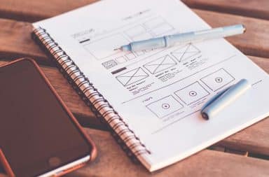 Web design wireframe sketch in a notebook