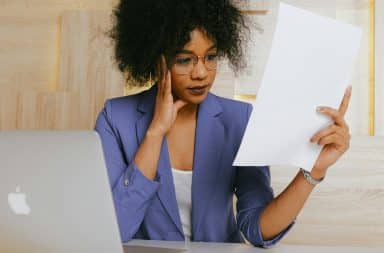 woman looking at a paper