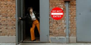 do not enter sign woman peeking out
