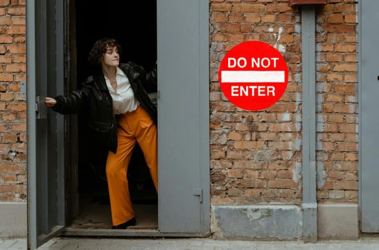 do not enter sign woman peeking out