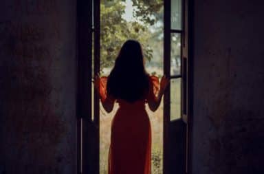 woman in a doorway, but why?!