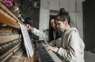 Piano teacher with student