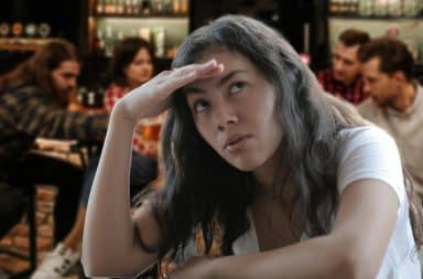 woman at the bar is confused