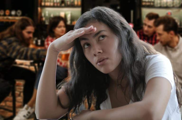 woman at the bar is confused
