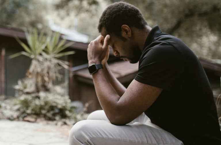 guy who is sad while sitting