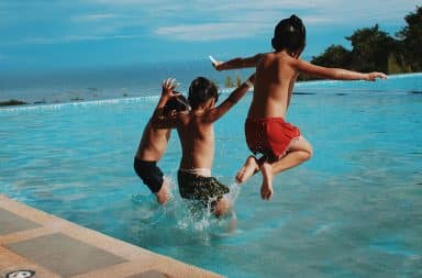 kids jumping in the pool