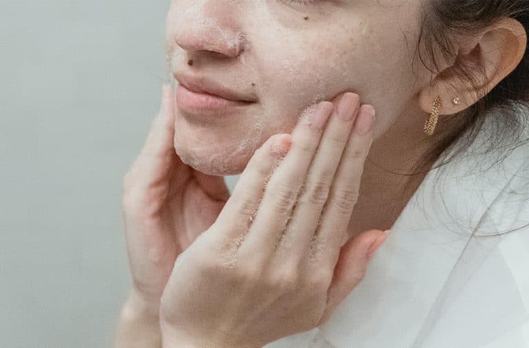 woman washing her face