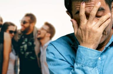 guy is sad becuase they're laughing but he is not