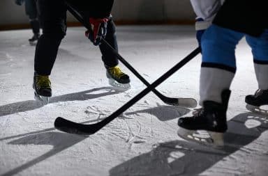 Hockey puck sticks