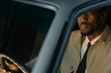 man thinkin in a car