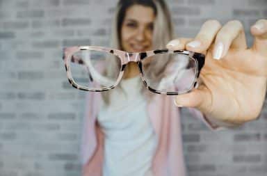 Woman with glasses in hand
