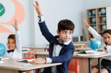 kids raising hands