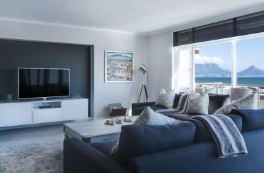 Living room by ocean and mountains