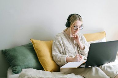 Woman in bed on laptop