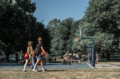 teens playing basketball