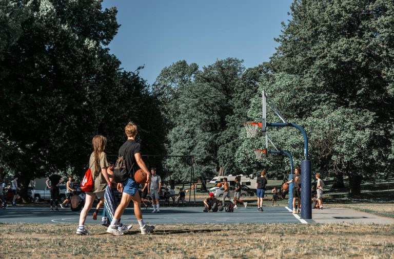 teens playing basketball