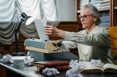 man using typewriter