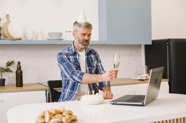 man at computer on birthday