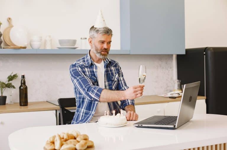 man at computer on birthday
