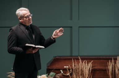 man giving eulogy at funeral