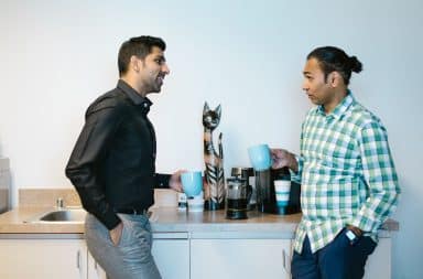 two men talking at office